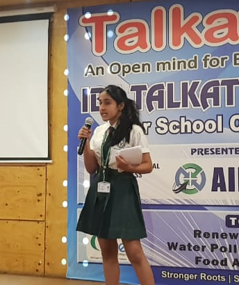 A Talkathon contestant speaking on stage